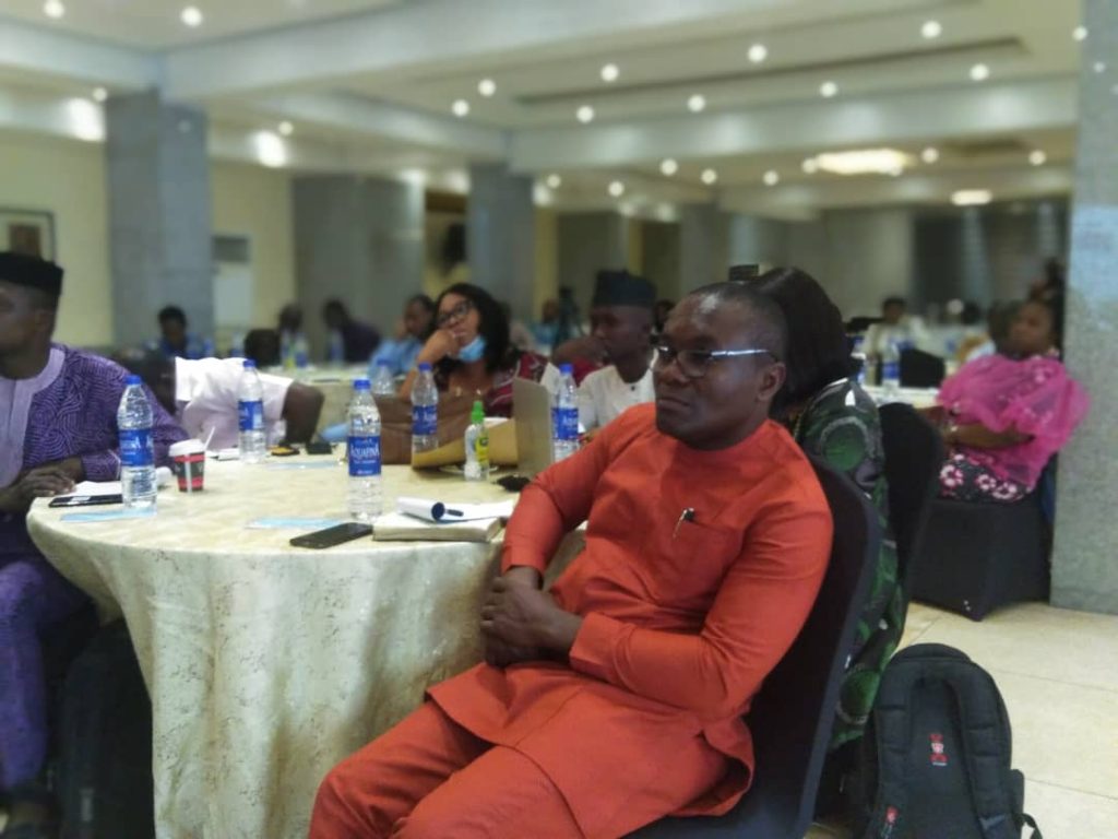 Man sitting down being attentive to a presentation